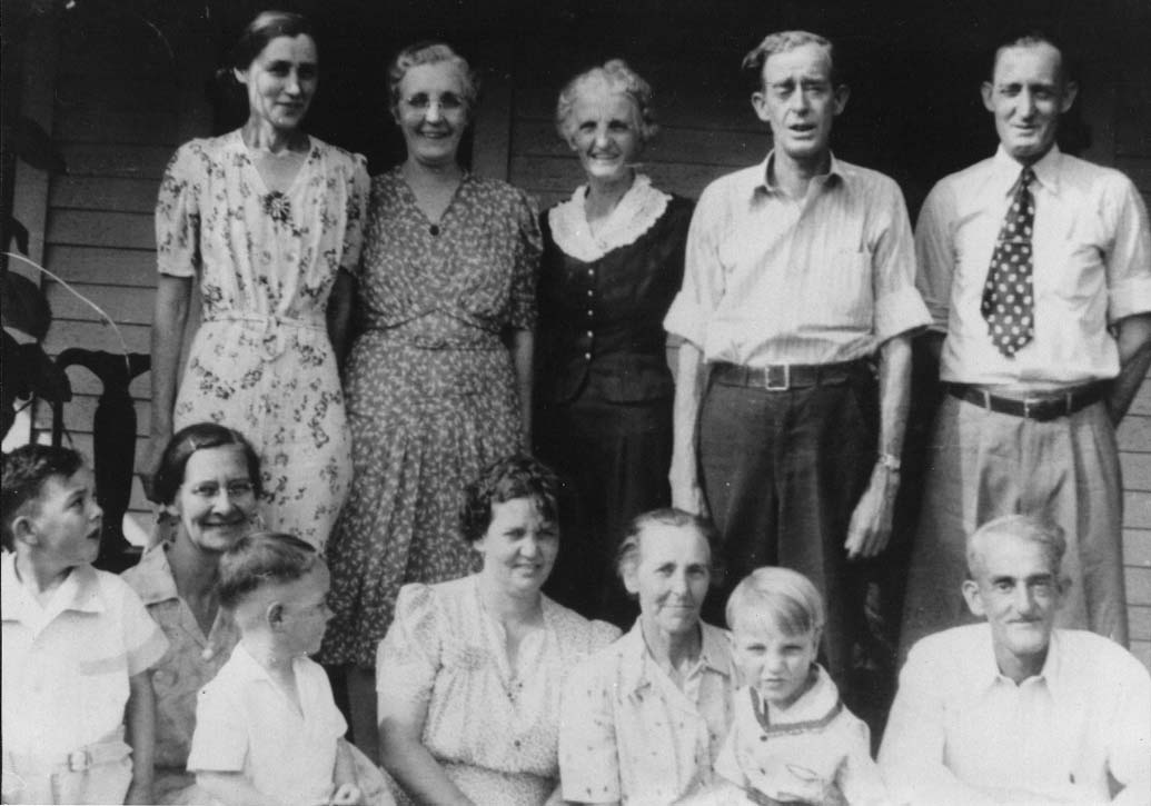 Children of Henry Barker and Emmeline Candace (Warford) Garrett: Top row - Pearl (Floyd) Garrett, Addie (Garrett) Cox, Ann (Garrett) Corbin, Hobart Garrett & Carmel Garrett Bottom row - Larry Garrett, Anna (Rice) Garrett, Dale Garrett, Ellen (Wilson) Garrett, Lyn (Garrett) Scrivner & grandson, Jimmy & McKinley Garrett