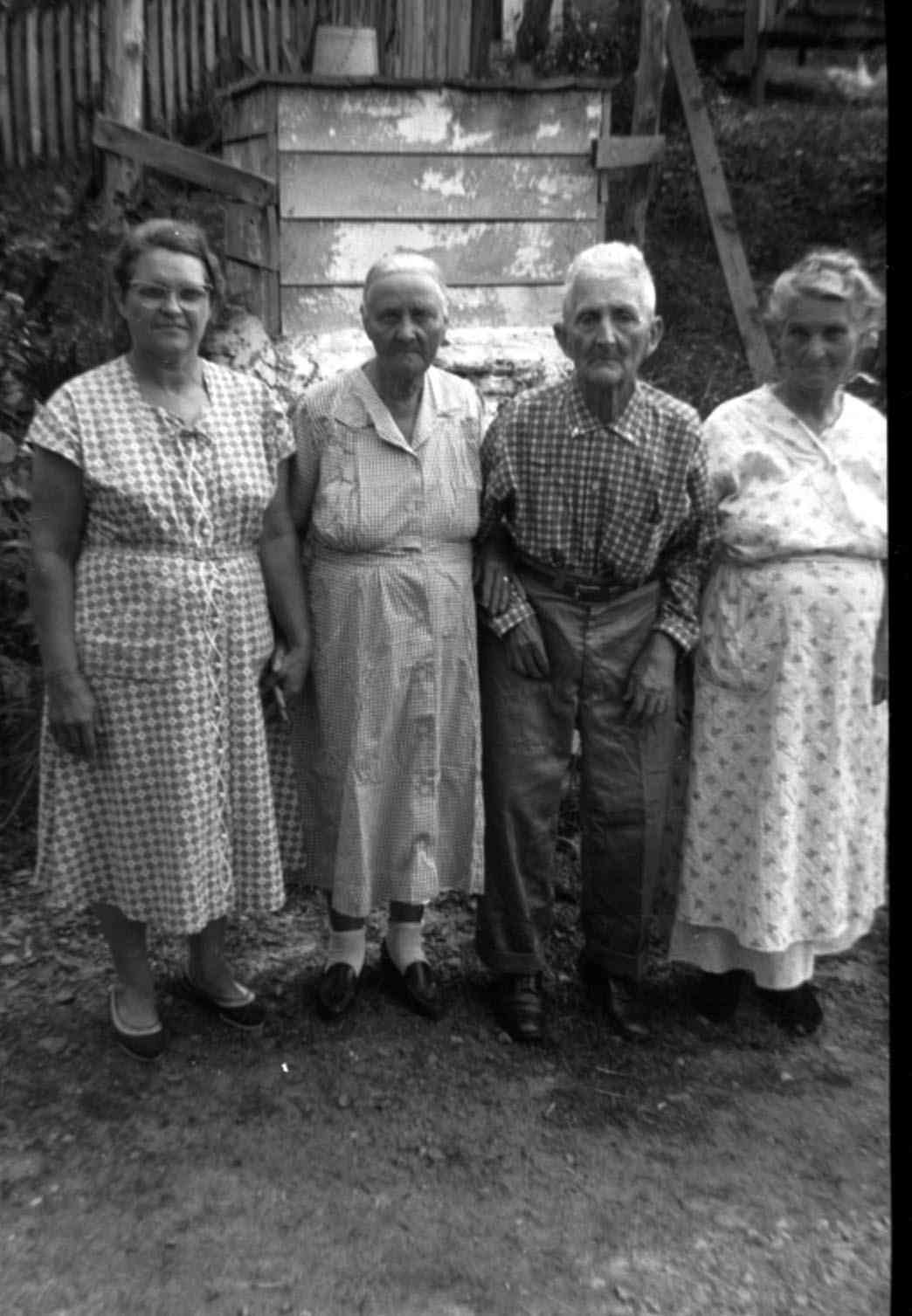 Nannie Lee (Newton) Reece and her aunt Nannie (Warner) Spicer and her husband Garfield Spicer. Taken at home of Decatur and Lucy (Warner) Newton Pryse, Ky. Nannie and Garfield lived their whole lives in Lee County at Old Landing and never had any children. I think this was their seventy fifth wedding anniversary.
