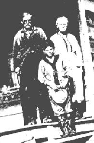 Francis Marion Powell & Mary Elizabeth West Powell with their grandson, Millard Powell