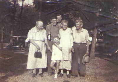 John & Cordilla (Ginter) Rison with their granddaughter and three Unknown people